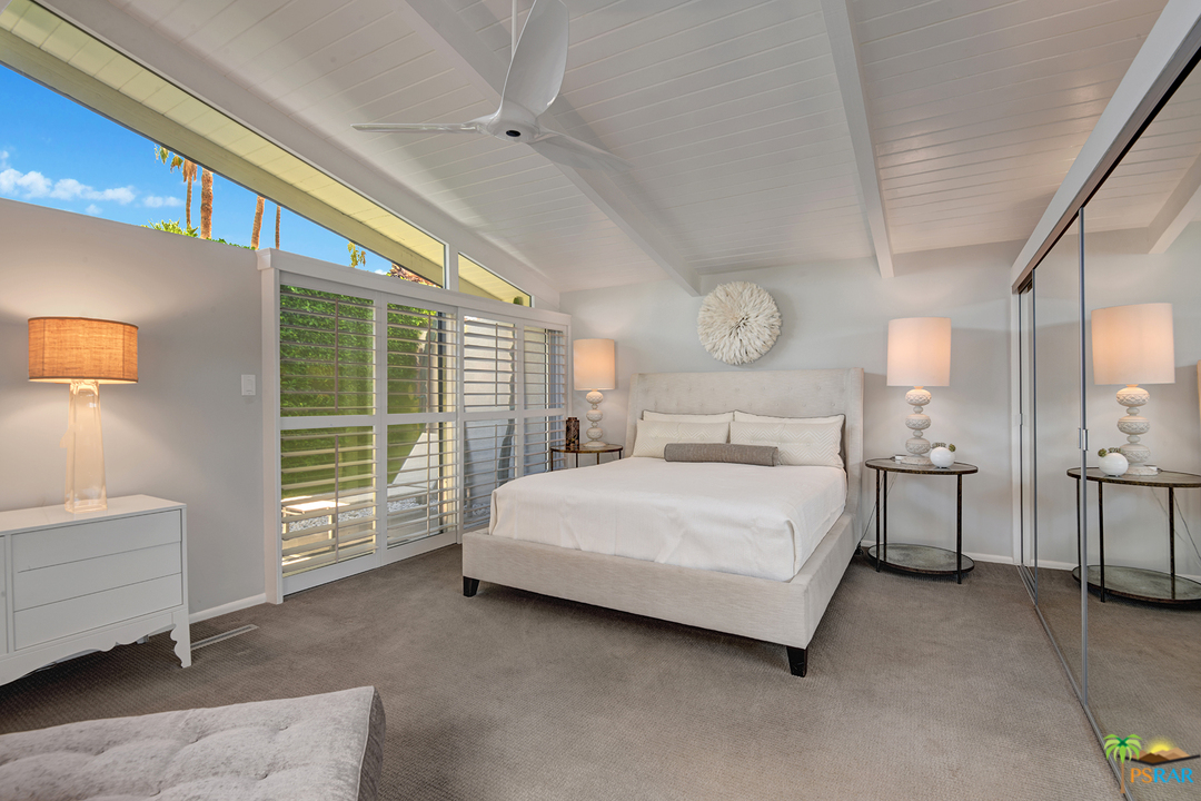984 East La Jolla Road Palm Springs, CA 92264 - Photo 18 of 53 a spacious bedroom with a bed and a large window