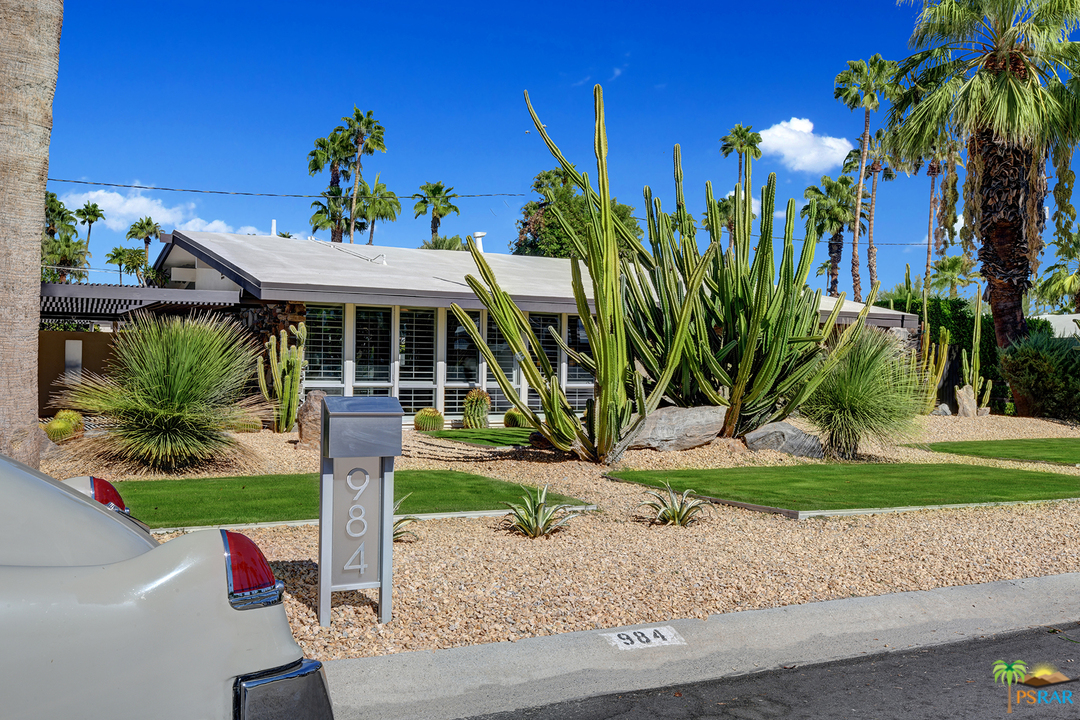 984 East La Jolla Road Palm Springs, CA 92264 - Photo 2 of 53 a front view of a house with a garden