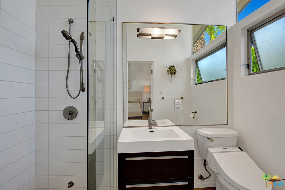 984 East La Jolla Road Palm Springs, CA 92264 - Photo 21 of 53 a bathroom with a sink a toilet and shower