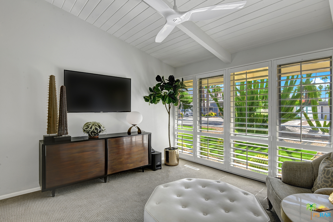 984 East La Jolla Road Palm Springs, CA 92264 - Photo 23 of 53 a living room with furniture and a flat screen tv