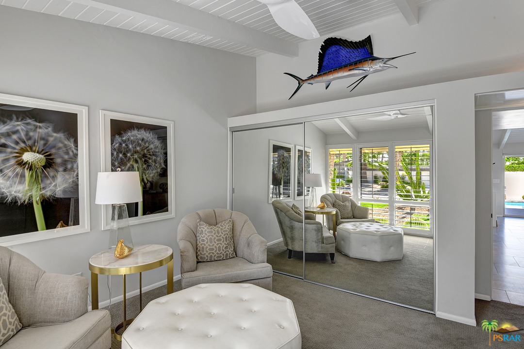 984 East La Jolla Road Palm Springs, CA 92264 - Photo 24 of 53 a living room with furniture and a large window