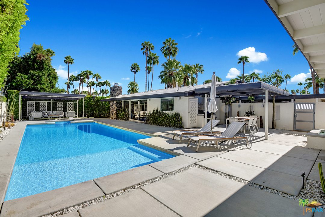 984 East La Jolla Road Palm Springs, CA 92264 - Photo 28 of 53 a view of a house with swimming pool and sitting area