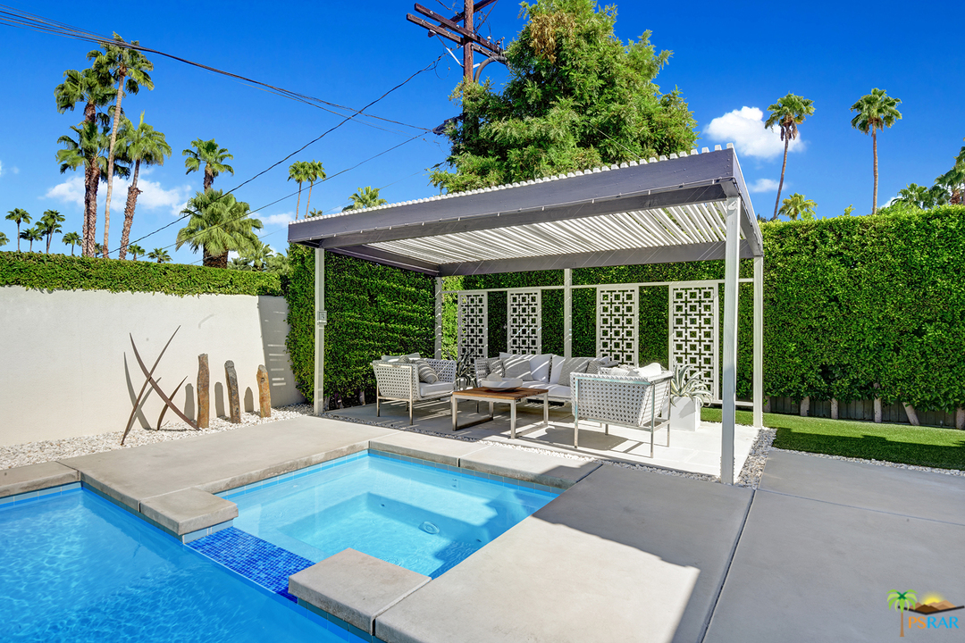 984 East La Jolla Road Palm Springs, CA 92264 - Photo 29 of 53 a view of a patio with couches table and chairs and potted plants