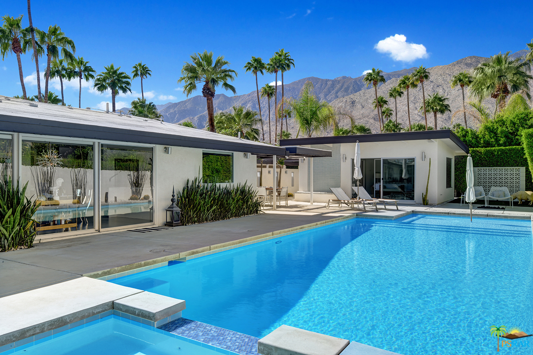 984 East La Jolla Road Palm Springs, CA 92264 - Photo 31 of 53 a view of a house with swimming pool and sitting area