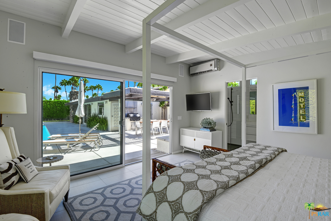 984 East La Jolla Road Palm Springs, CA 92264 - Photo 33 of 53 a bedroom with furniture and large windows