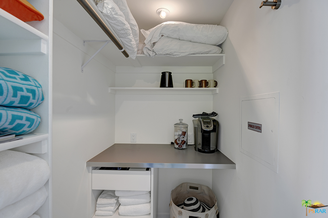 984 East La Jolla Road Palm Springs, CA 92264 - Photo 37 of 53 a kitchen with a sink and cabinets