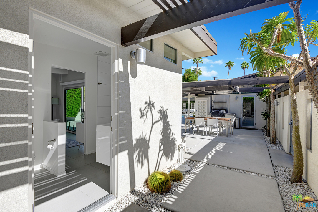 984 East La Jolla Road Palm Springs, CA 92264 - Photo 38 of 53 a view of a patio with table and chairs potted plants