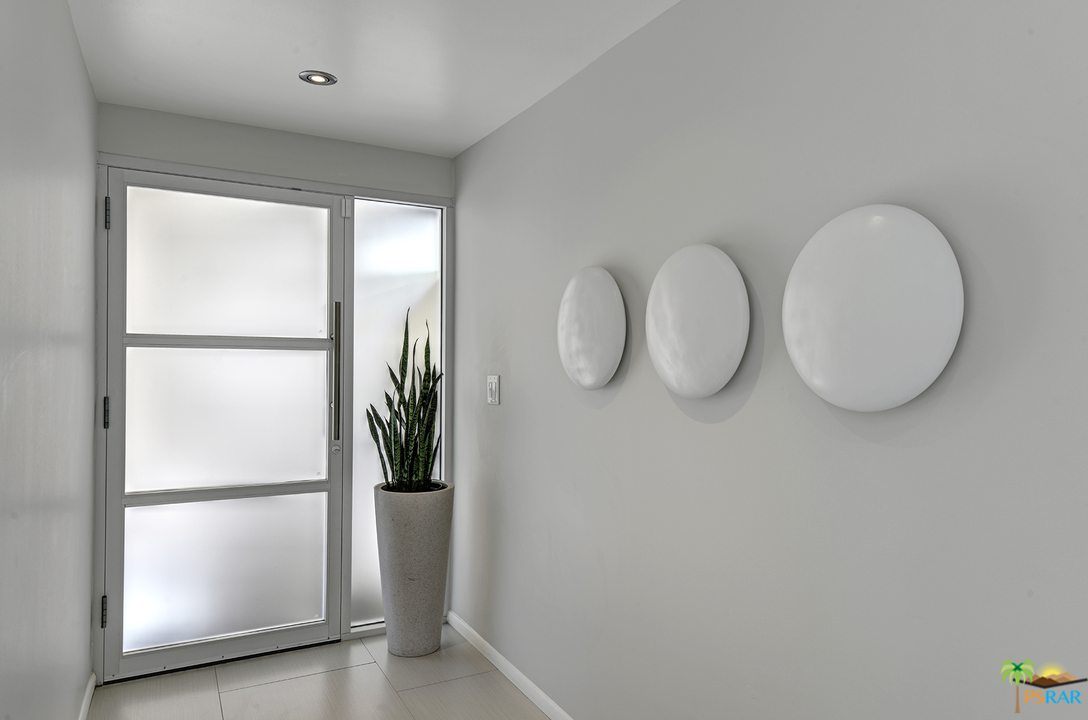 984 East La Jolla Road Palm Springs, CA 92264 - Photo 42 of 53 a view of a room with wooden floor and white doors