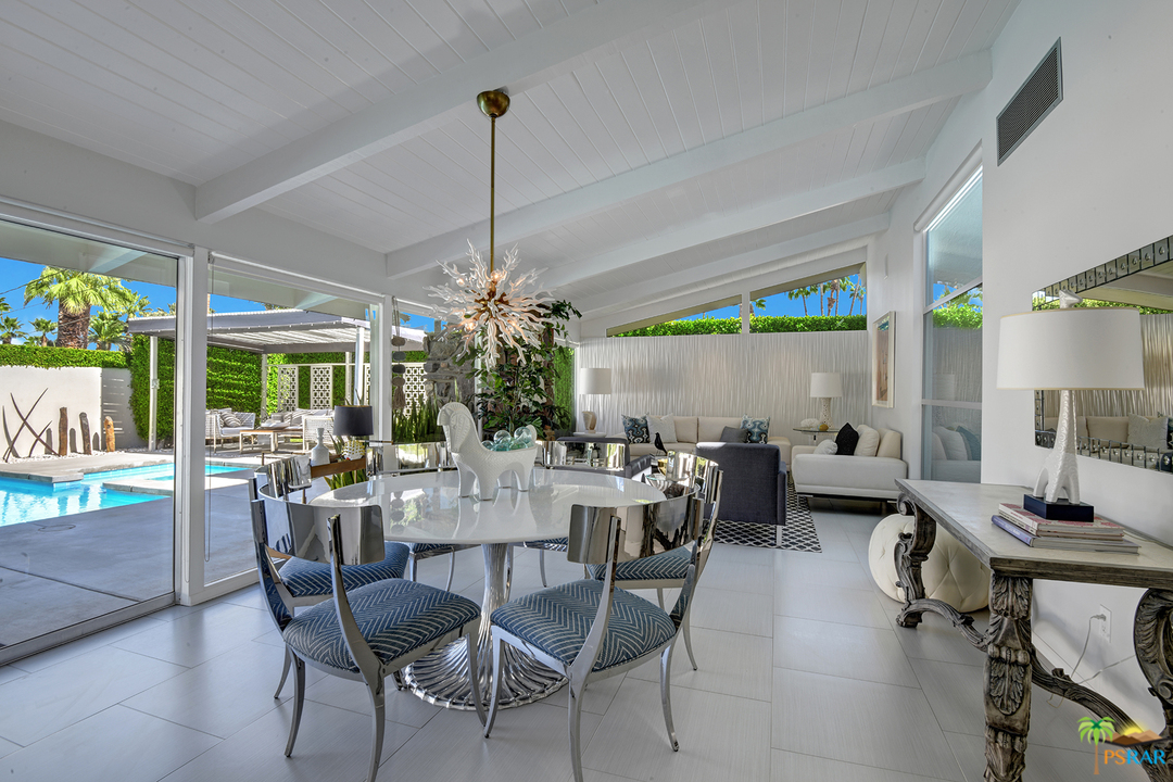 984 East La Jolla Road Palm Springs, CA 92264 - Photo 6 of 53 a view of a dining room with furniture window and outdoor kitchen