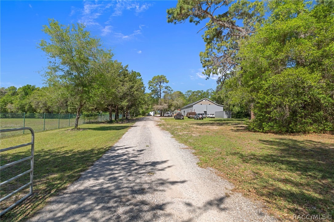 4530 South Florida Avenue Inverness, FL 34450 - Photo 99 of 100 a view of a swimming pool with a yard