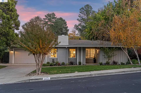 a view of a backyard with sitting area