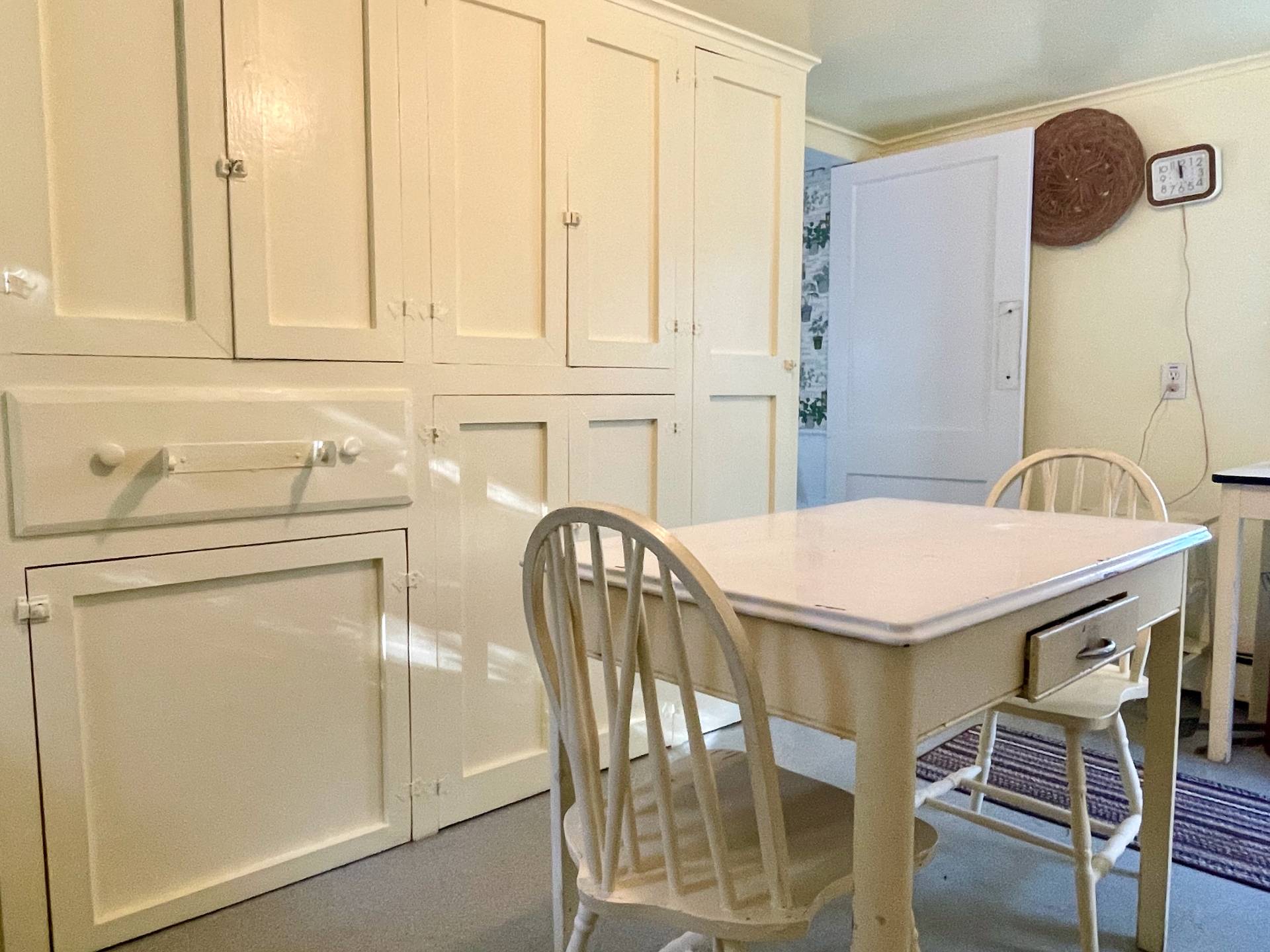 328 Town Line Road Sagaponack, NY 11962 - Photo 12 of 25 a kitchen with a table chairs and a refrigerator