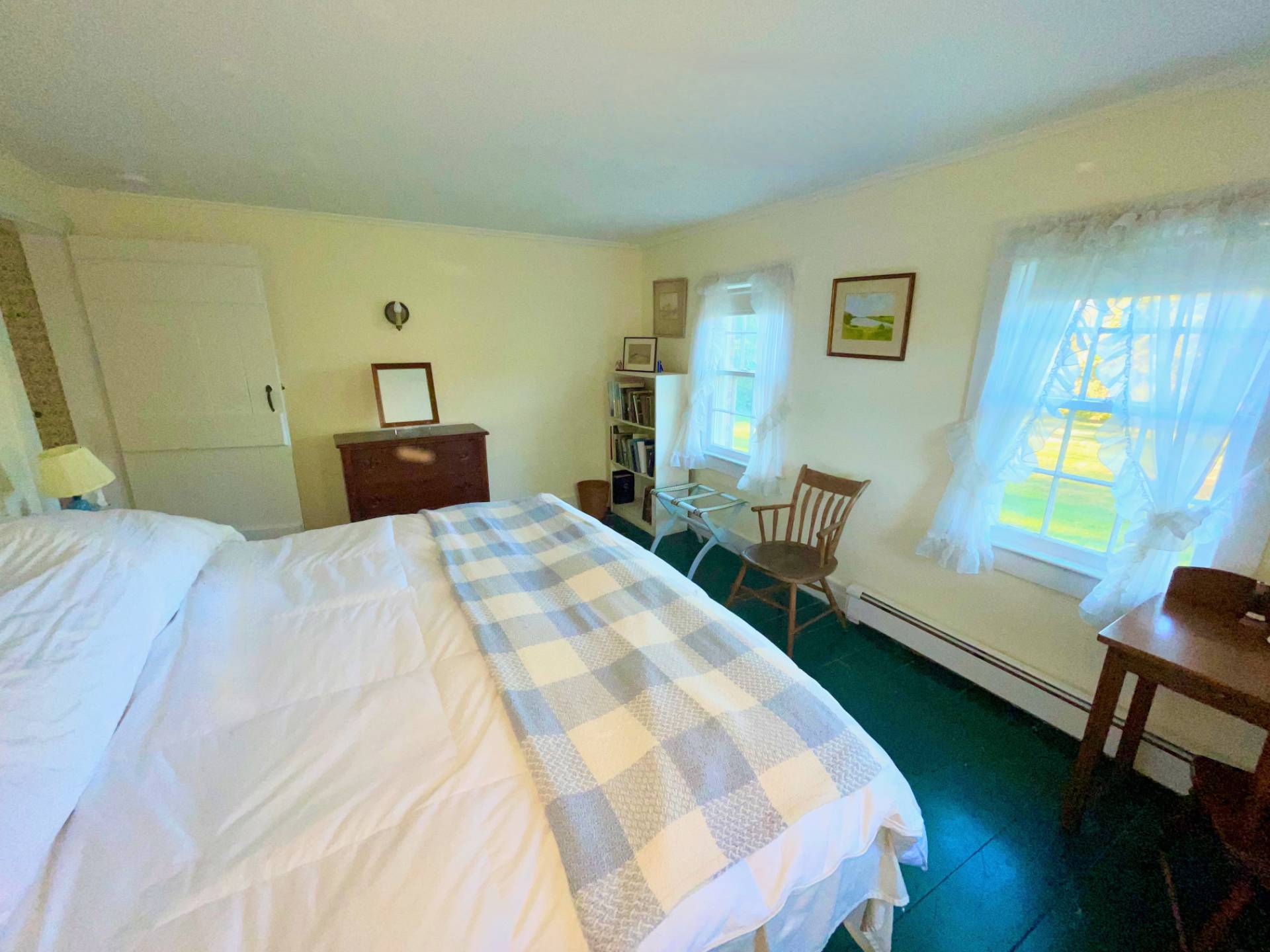 328 Town Line Road Sagaponack, NY 11962 - Photo 16 of 25 a bedroom with a bed a table and chair