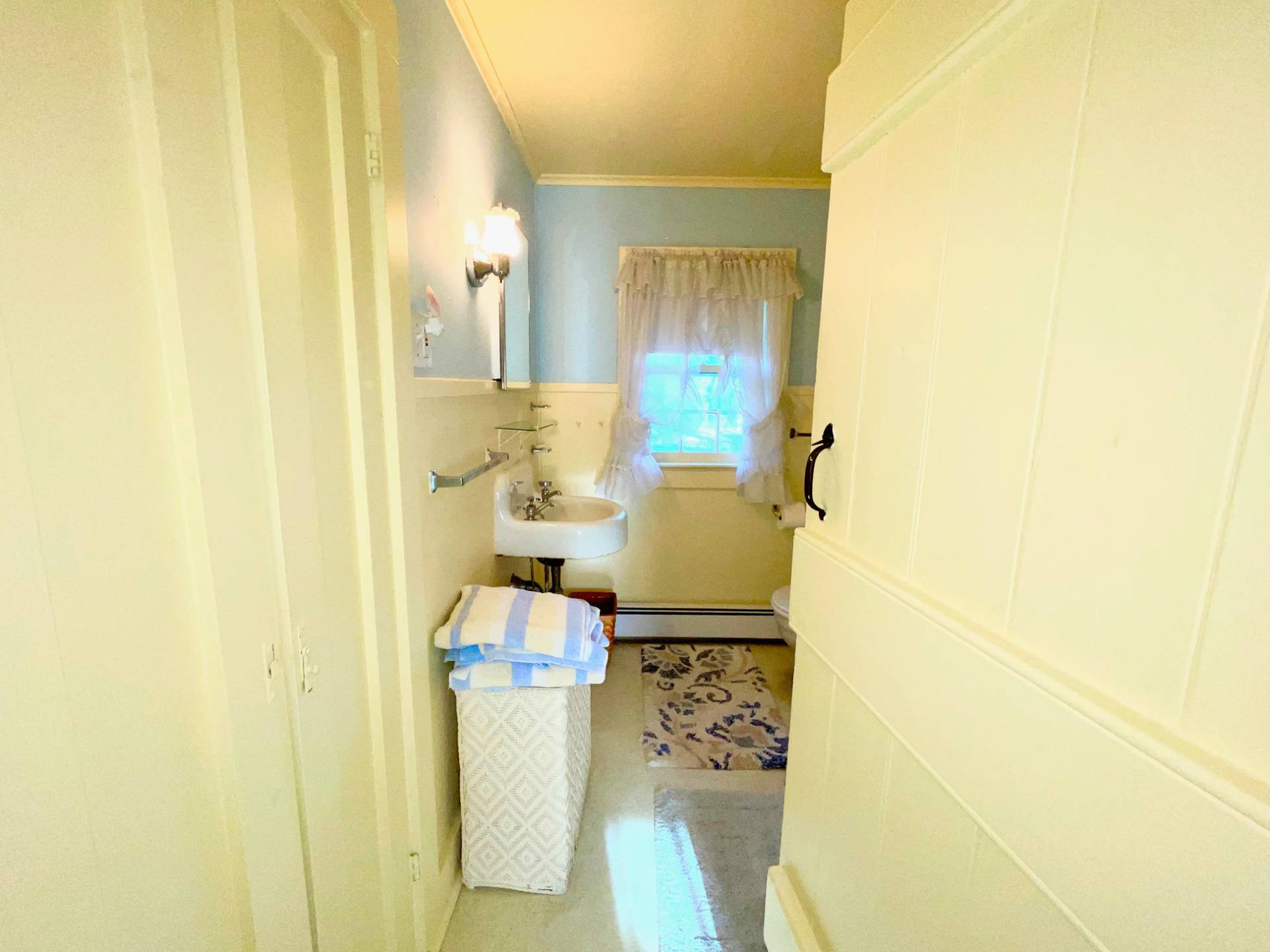 328 Town Line Road Sagaponack, NY 11962 - Photo 17 of 25 a view of bathroom with a sink and mirror