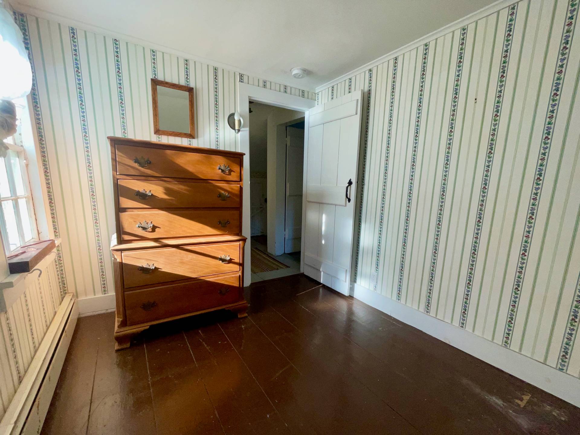 328 Town Line Road Sagaponack, NY 11962 - Photo 21 of 25 a view of a hallway with wooden floor and closet