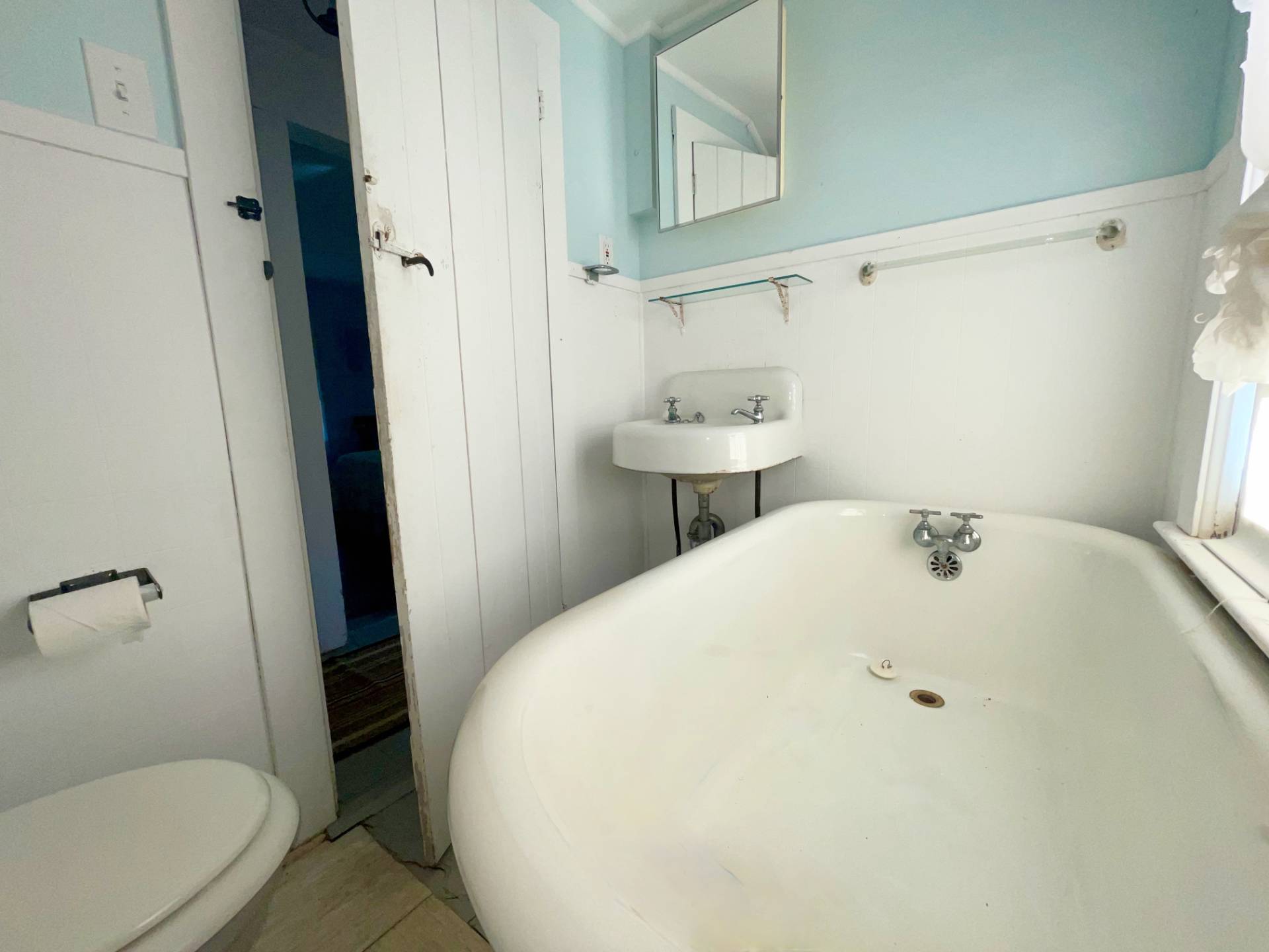 328 Town Line Road Sagaponack, NY 11962 - Photo 23 of 25 a bathroom with a sink a toilet and a mirror