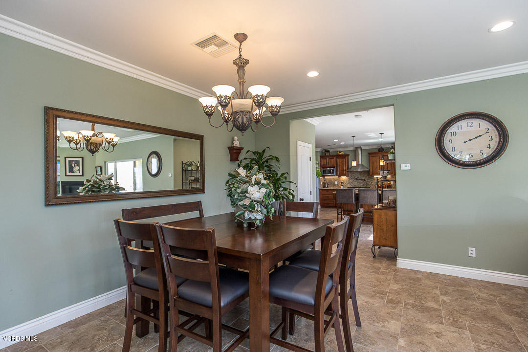 959 Rancho Road Thousand Oaks, CA 91362 - Photo 13 of 57 a dining room with furniture a chandelier and wooden floor