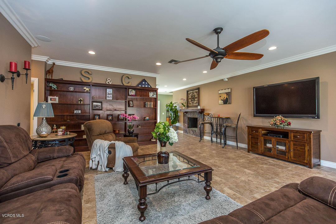 959 Rancho Road Thousand Oaks, CA 91362 - Photo 17 of 57 a living room with furniture and a flat screen tv