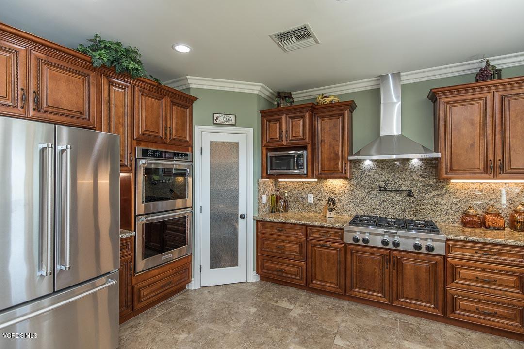 959 Rancho Road Thousand Oaks, CA 91362 - Photo 22 of 57 a kitchen with stainless steel appliances granite countertop a refrigerator stove and cabinets