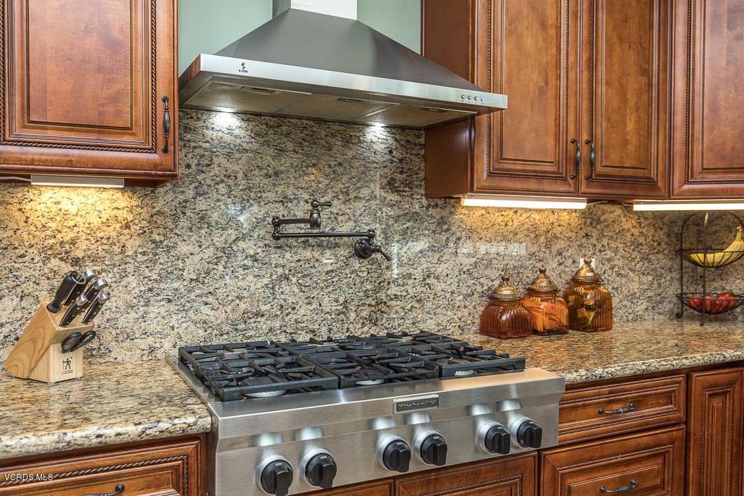 959 Rancho Road Thousand Oaks, CA 91362 - Photo 23 of 57 a kitchen with granite countertop a stove and a sink