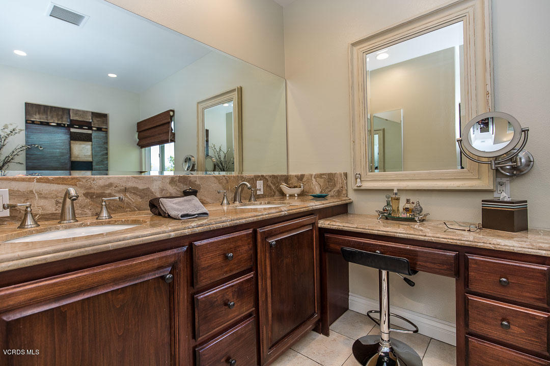 959 Rancho Road Thousand Oaks, CA 91362 - Photo 30 of 57 a bathroom with a sink and a mirror