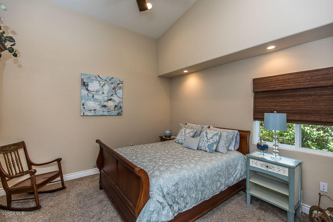 959 Rancho Road Thousand Oaks, CA 91362 - Photo 32 of 57 a bedroom with a bed and a painting on the wall