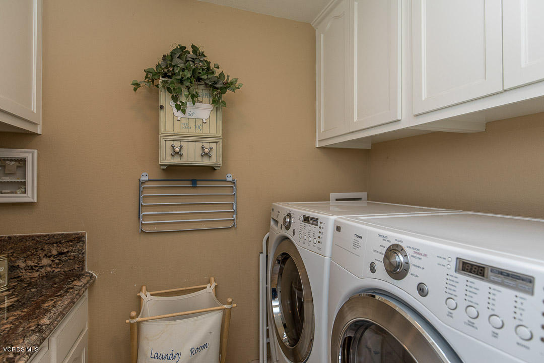959 Rancho Road Thousand Oaks, CA 91362 - Photo 37 of 57 a view of washer and dryer with bathroom in the background
