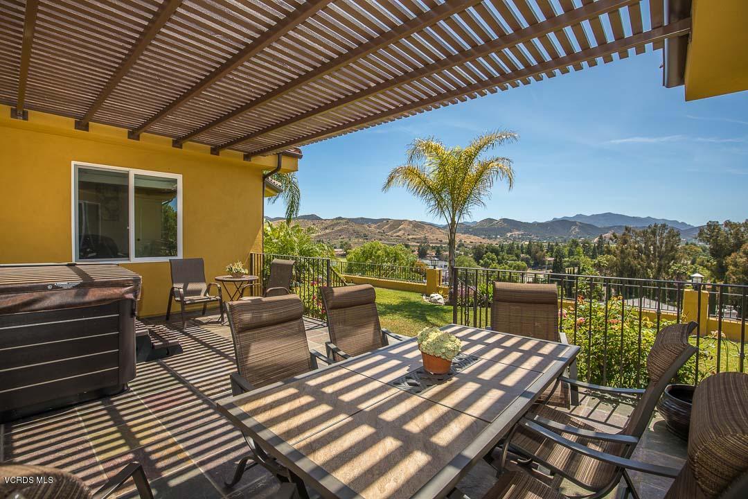 959 Rancho Road Thousand Oaks, CA 91362 - Photo 39 of 57 a view of a patio with couches chairs and wooden floor