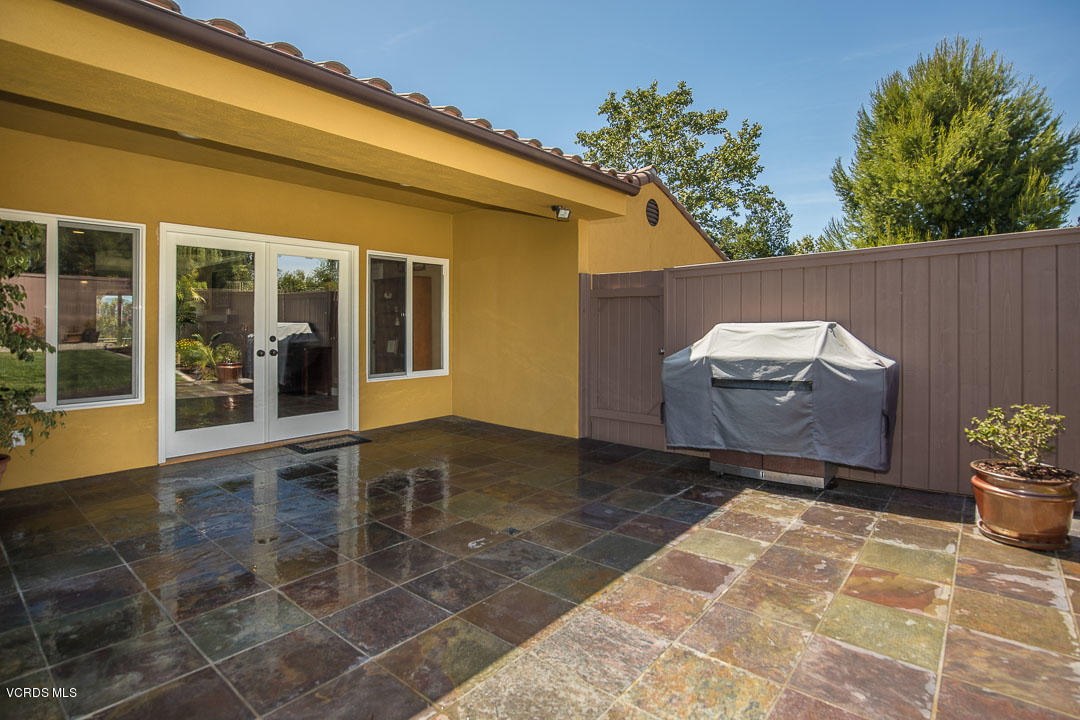 959 Rancho Road Thousand Oaks, CA 91362 - Photo 49 of 57 a backyard of a house with table and chairs
