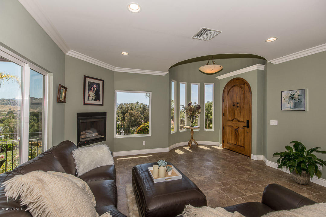 959 Rancho Road Thousand Oaks, CA 91362 - Photo 10 of 57 a living room with furniture and a fireplace