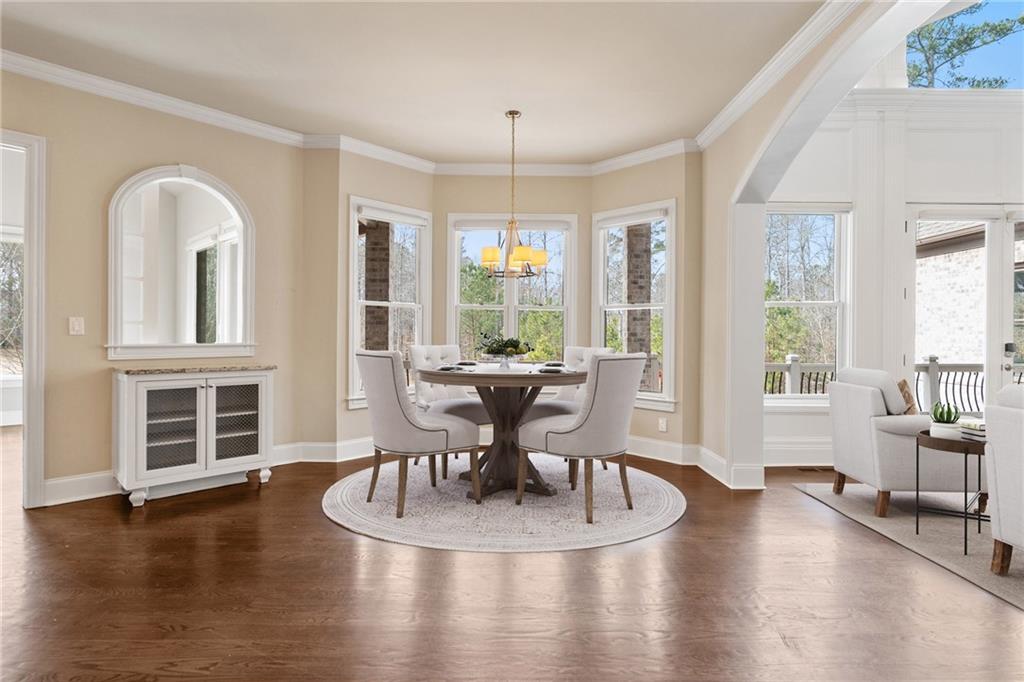 14560 Wood Road Milton, GA 30004 - Photo 20 of 74 a view of a dining room with furniture window and wooden floor