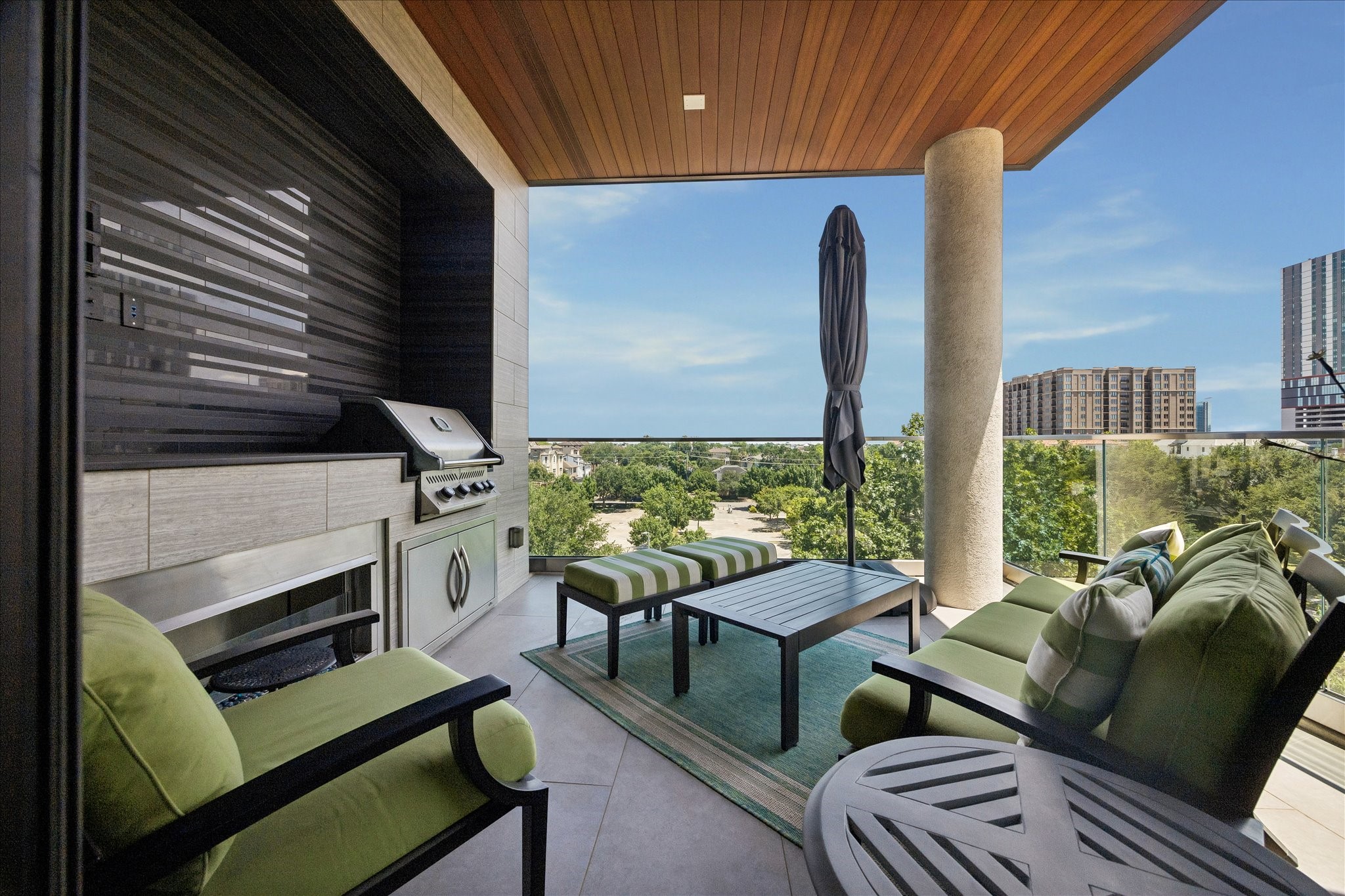5104 Caroline Street, Unit 403 Houston, TX 77004 - Photo 5 of 33 Outdoor patio overlooking museum district with gas grill and fire ribbon fireplace