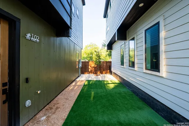 a view of yard with patio