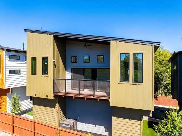 a front view of a house with large windows