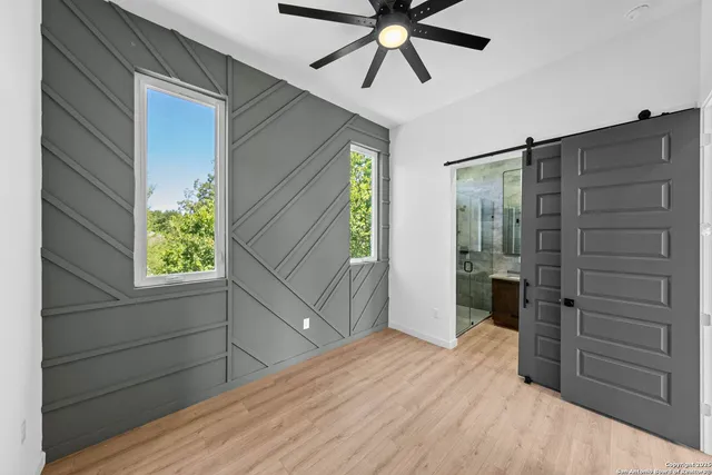 a bedroom with a bed and a closet