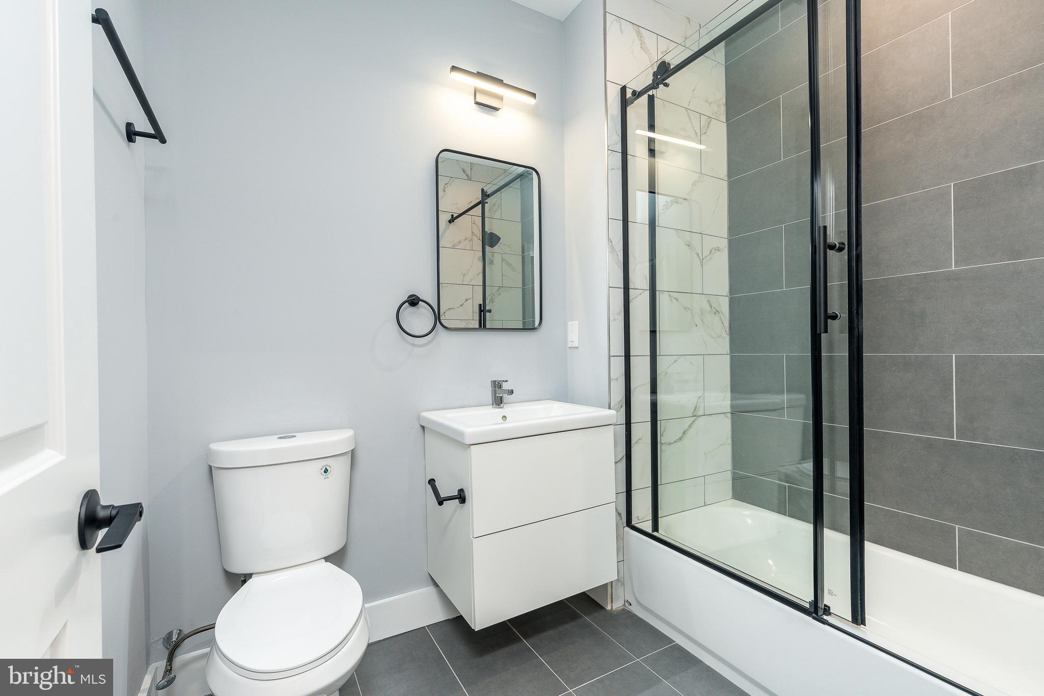 2821 Livingston Street, Unit 2 Philadelphia, PA 19134 - Photo 13 of 24 a bathroom with a toilet sink and shower