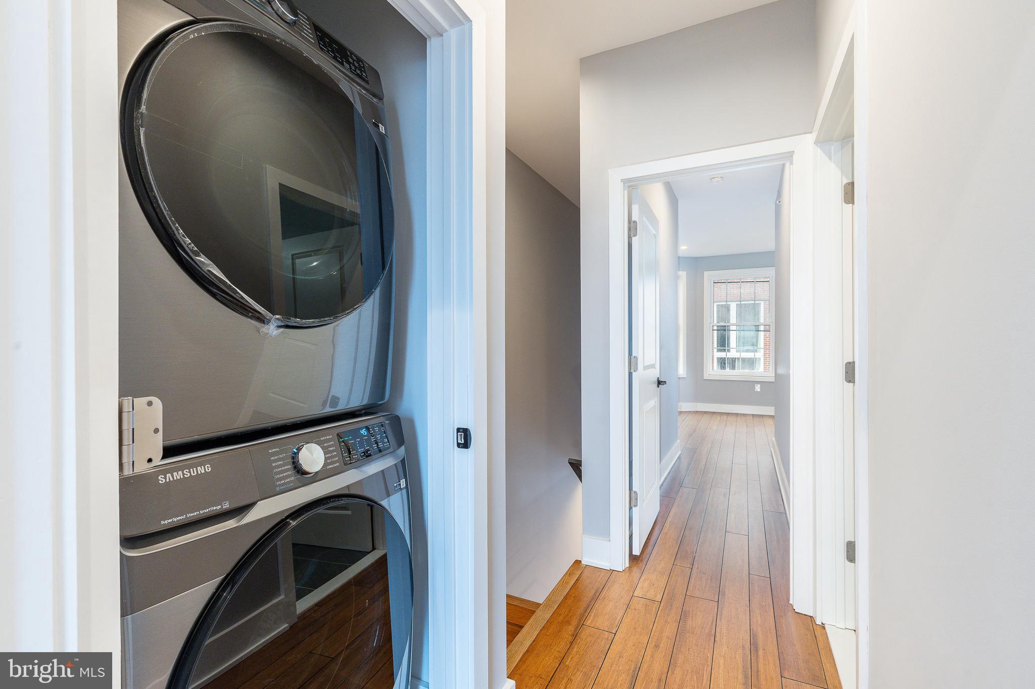 2821 Livingston Street, Unit 2 Philadelphia, PA 19134 - Photo 16 of 24 a view of a hallway with washer and dryer