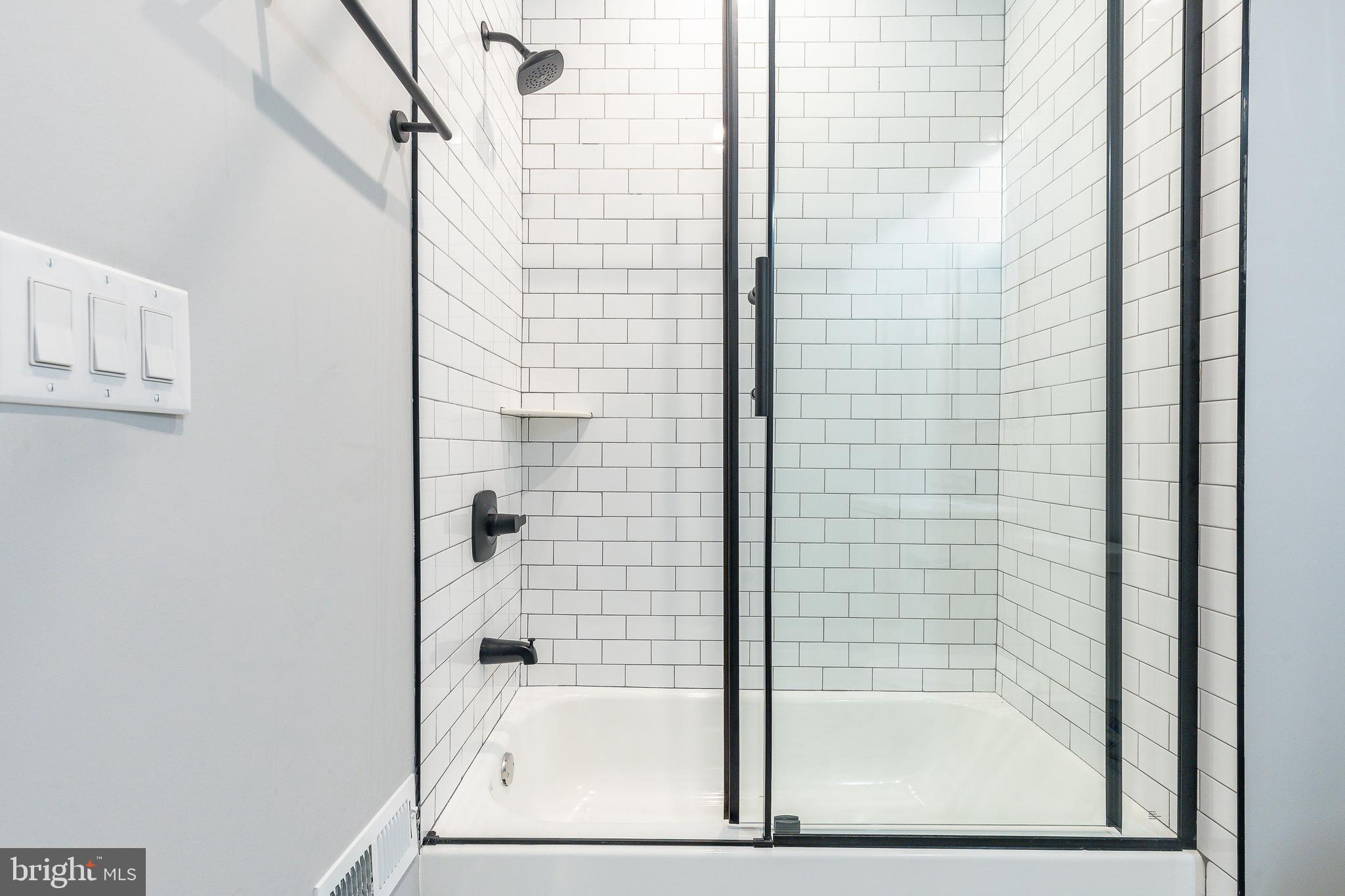2821 Livingston Street, Unit 2 Philadelphia, PA 19134 - Photo 18 of 24 a bathroom with a shower