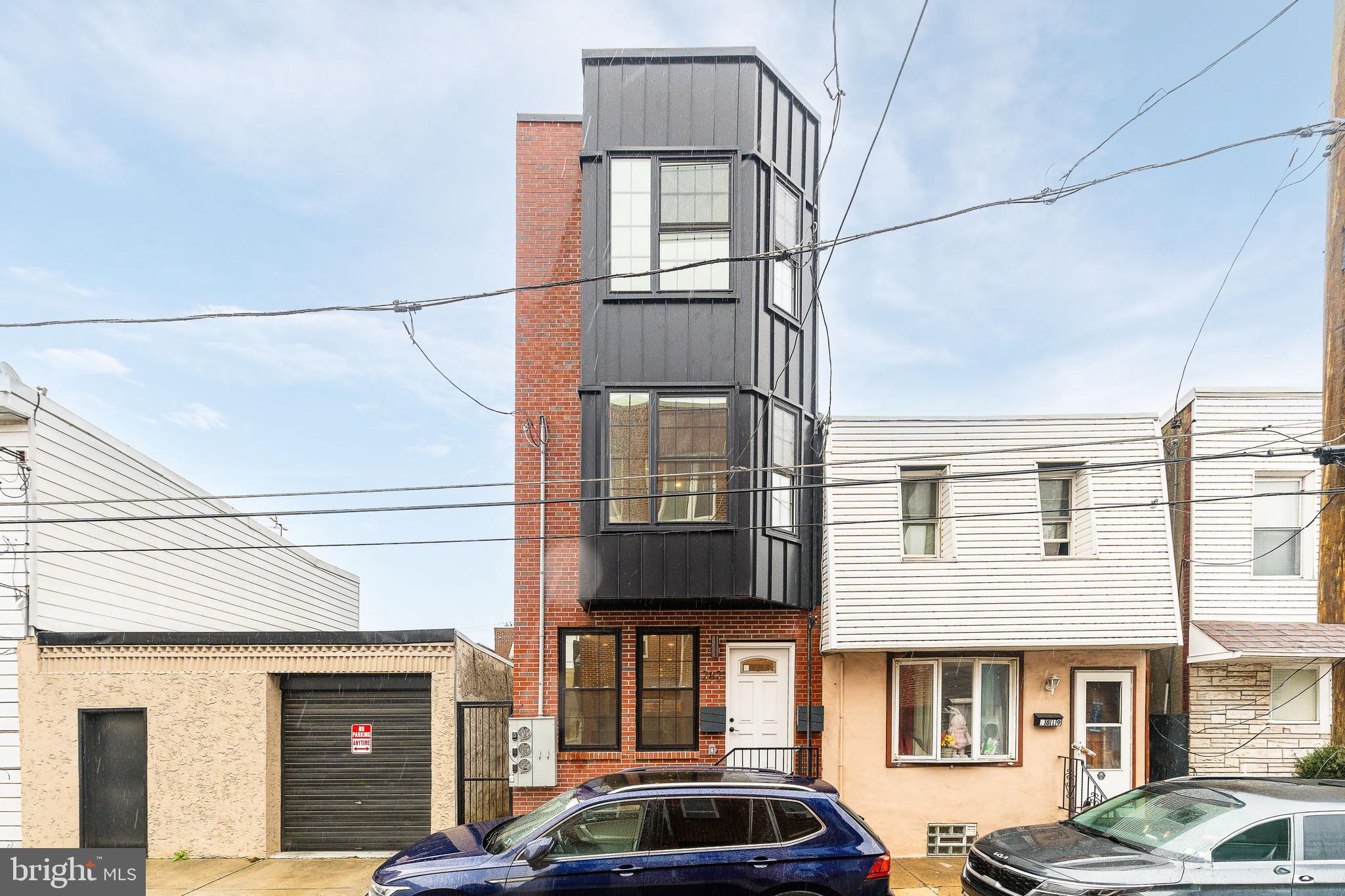 2821 Livingston Street, Unit 2 Philadelphia, PA 19134 - Photo 22 of 24 a front view of a building with parking space