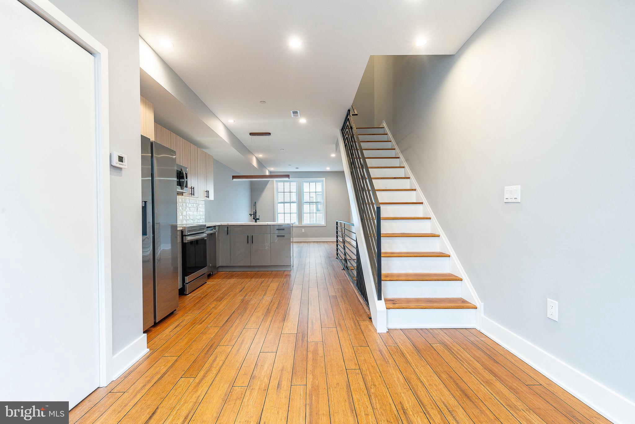 2821 Livingston Street, Unit 2 Philadelphia, PA 19134 - Photo 10 of 24 a view of a room with wooden floor and staircase