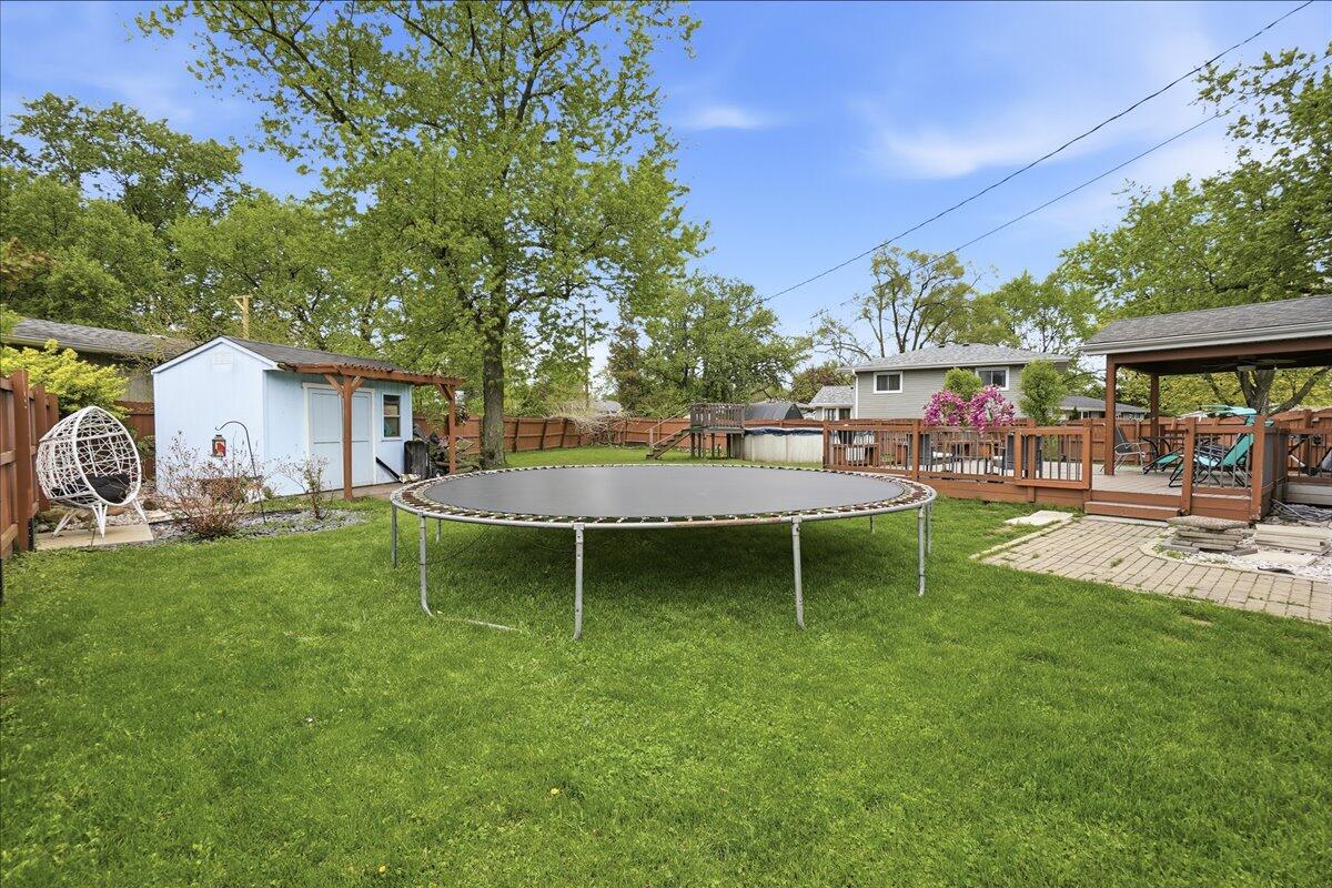 741 Pettibone Street Crown Point, IN 46307 - Photo 34 of 34 a backyard of a house with table and chairs