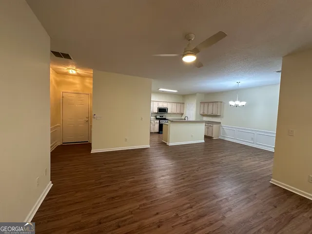 a bathroom with a sink double vanity granite and a mirror
