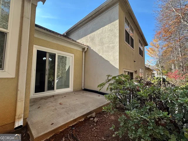a kitchen with a sink cabinets and wooden floor