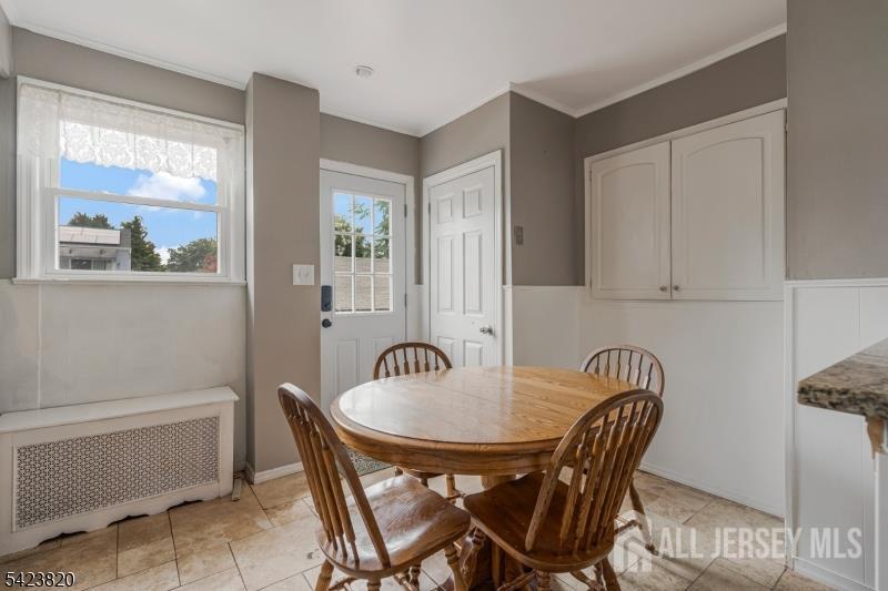110 Parker Street Middlesex, NJ 08846 - Photo 6 of 25 a view of a a dining room with furniture window and wooden floor