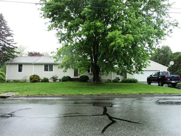 98 Long Road Fairhaven, MA 02719 - Photo 2 of 9 a front view of a house with a yard and garage