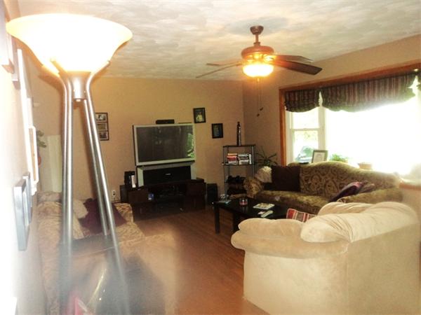 98 Long Road Fairhaven, MA 02719 - Photo 4 of 9 a living room with furniture and a chandelier