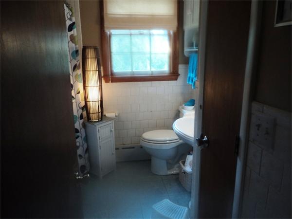 98 Long Road Fairhaven, MA 02719 - Photo 9 of 9 a white toilet sitting next to a bathroom sink