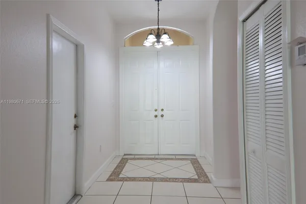 a view of an empty room and a window