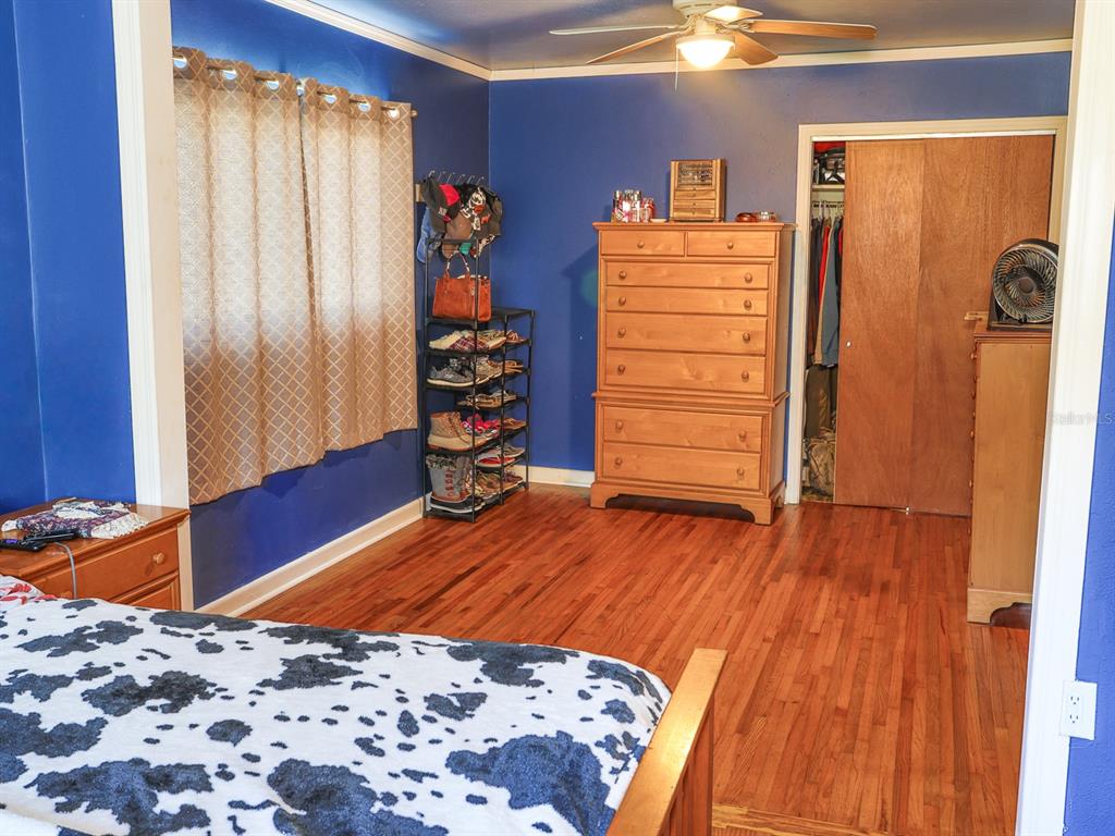 2140 East Main Street Bartow, FL 33830 - Photo 14 of 37 a bedroom with a bed and wooden floor