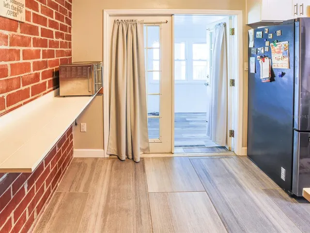 a kitchen with stainless steel appliances a sink stove and cabinets